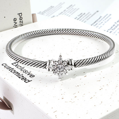 RYQEN micro-pavéd cubic zirconia star cuff Celestial Twist Star Bracelet Retro-style cuffs Stellar Twist Constellation Cuff Celestial Jewelry Minimalist luxury bracelet 2025